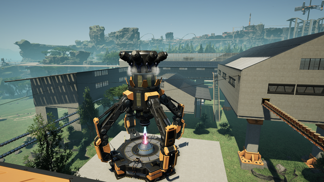 A power augmentor stands among various factory buildings.