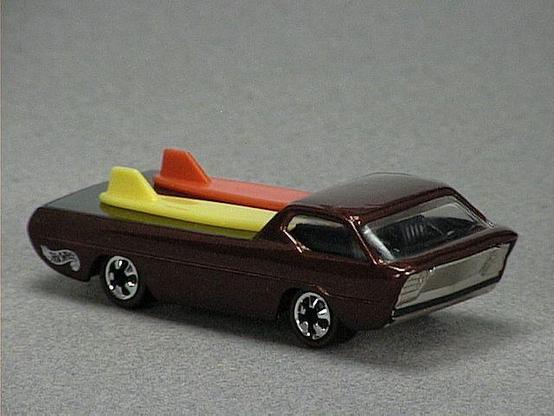 Released in 1994, Metal Flake Light Green Deora of Vintage Series with Redline wheels. Notes: Hot Wheels Vintage logo in chassis, two surfboards on back. Tampo: Hot Wheels logo in white. Packaging: Vintage Series Blister. Metal Body, Metal Base. Made in China. Scarcity: 2/10