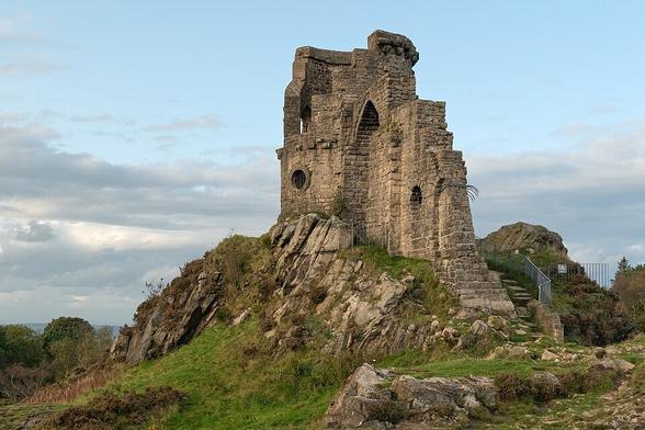 Mow Cop Castle, an 18th-century folly straddling the Cheshire–Staffordshire border built to resemble a ruinous castle.