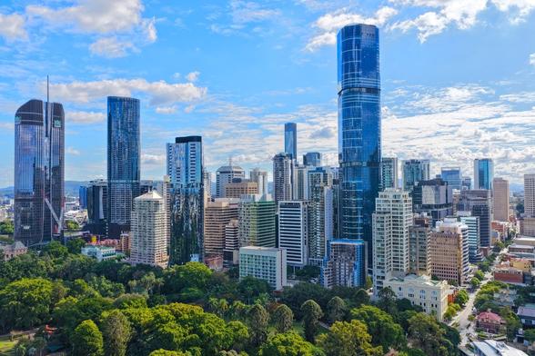 The Brisbane City CBD, looking over the botanical gardens, towards the city center. Aerial shot, taken from the river