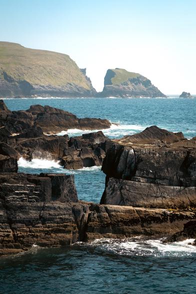 waves crashing against a sea stack