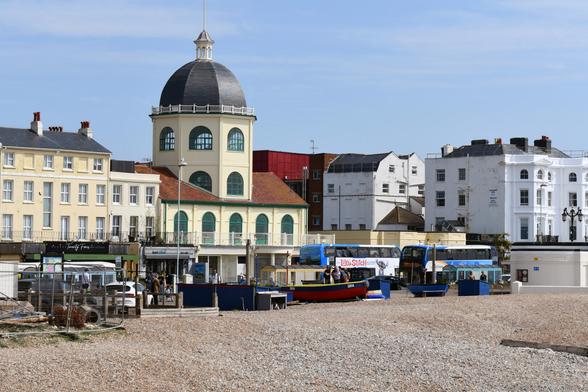 Photo of a Grade 2* listed cinema with domed tower, designed by Theophilus Arthur Allen, 1911, in the Edwardian Baroque style.  Said to be one of the best five early cinemas to survive in England. Worthing Marine Parade, Sussex, UK.
