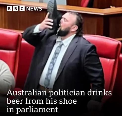 Australian politician drinking beer from his shoe in parliament