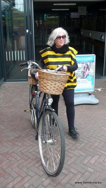 Judy looking good in her bee outfit, pushing her bike and ready to go.