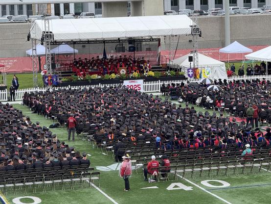 Cornell class of 2025 assembled on the football field