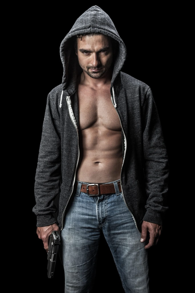 Day 5:  The villain is getting too Photo: DepositPhotos - photographer: nstanev - "Young Man with a Gun on Black Background"