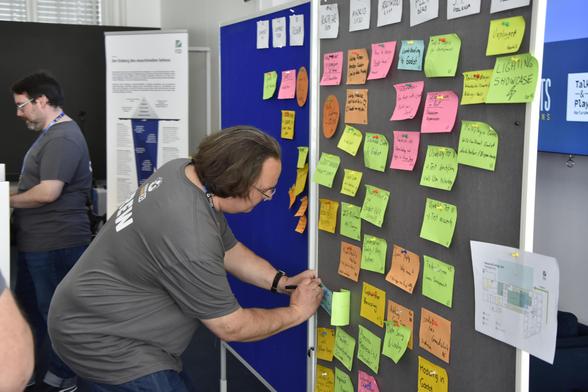 A crew member managing the session board