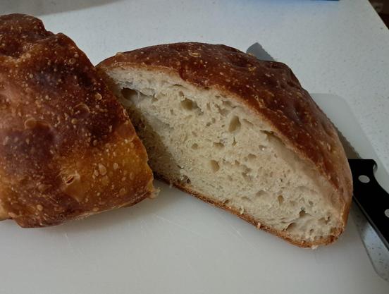 round loaf sliced down the middle to reveal the crumb