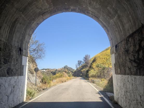 pov exiting a tunnel on a bicycle