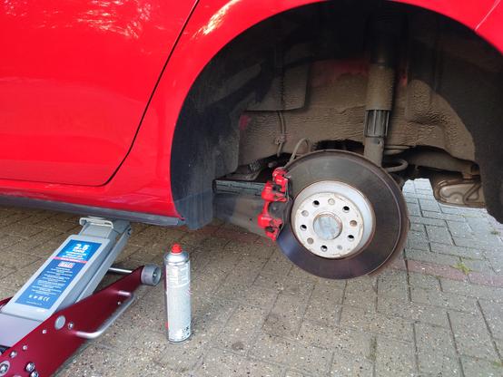 Rear of Golf, GTI raised on Sealey trolley jack, a can of Holts brake cleaner is next to the jack