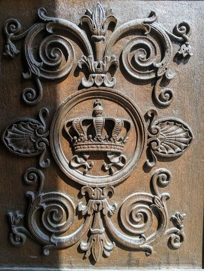 Bavarian regal emblem on a huge wooden palace door