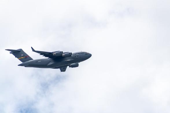 A large Air Force jump jet taking backdropped by cloudy sky