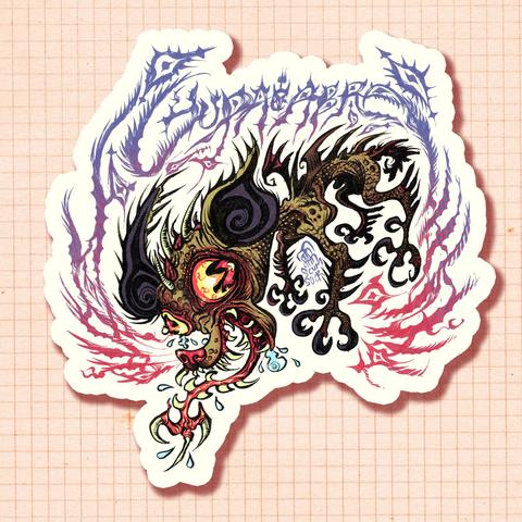a drawing of a green chihuahua with bloodshot eyes, a spiky back and wings, and a three-pronged tongue spitting and foaming.  Above it is a spiky handwritten title: CHUPACABRA.  It has a white stroke around it to emulate how a sticker cutline would look.