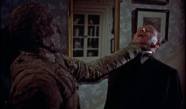Christopher Lee as the Mummy, choking Raymond Huntley as Joseph Whemple in Hammer Films’ The Mummy (1959)