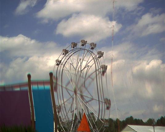 The ferris wheel at Oaks amusement park. I moved the camera when I took this, and the wheel is stretched up and down in the middle.