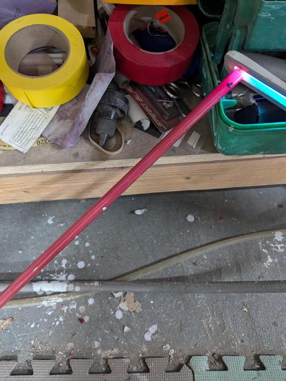 A gold pink, with the UV C color checker held up to its end, revealing the intense pink from the filtered pink phosphorr. Really excited for this one!