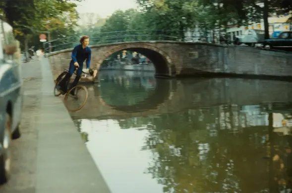A cyclist falls into a canal