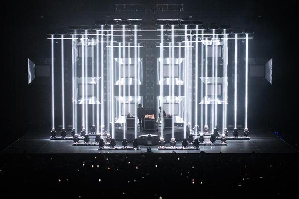Justice's live setup with dozens of projectors shining down on Xavier and Gaspard, as if surrounded in a cage of lights.