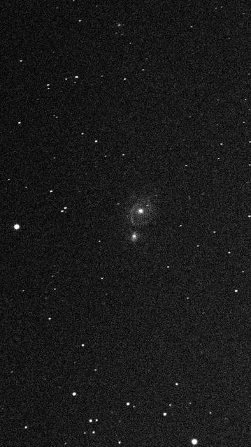 An astronomical image featuring a galaxy and numerous stars against a dark background, showcasing faint details of the galaxy and scattered points of light representing stars.

Astronomiczny obraz przedstawiający galaktykę i liczne gwiazdy na ciemnym tle, pokazujący słabe szczegóły galaktyki i rozproszone punkty światła reprezentujące gwiazdy.