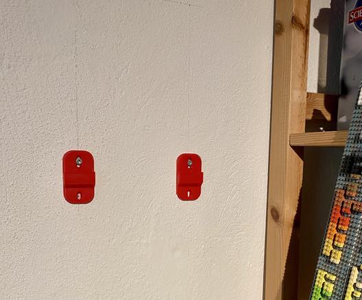 Top two brackets on the wall with one screw each. Bottom bracket is another type that locks it all in place