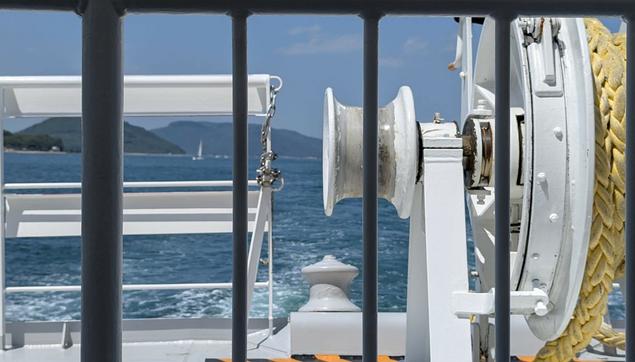 The Seto Inland Sea seen from the back of the ferry. The picture really shows part of the ferry (ropes, guardrails, etc) rather than the sea itself.