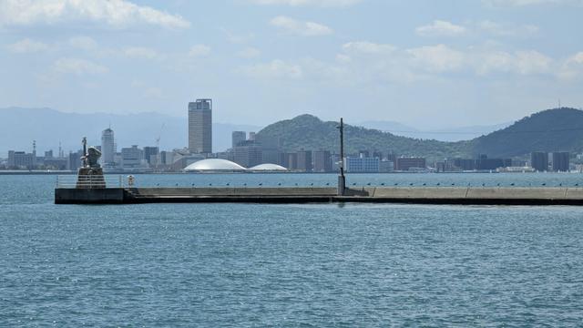 The Kagawa Arena seen from Megijima's port. There's also Takamatsu skyline as well as the Oni Lighthouse from Megijima.