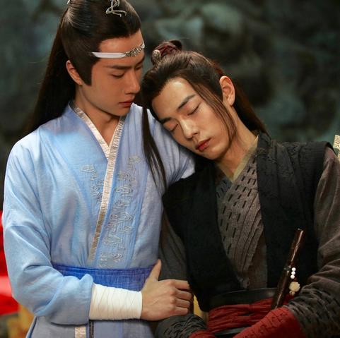 In the cave in the Burial Mounds during Lan Wangji's visit, Lan Wangji supports Wei Wuxian where the other man has collapsed against him.