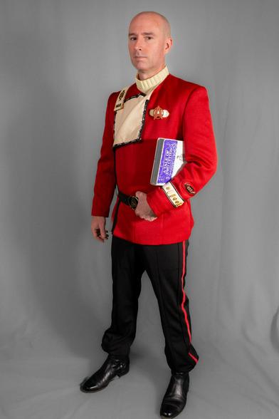 Photo of myself in a full "monster-maroon" Starfleet uniform, with a battered copy of A Tale of Two Cities held under my arm.