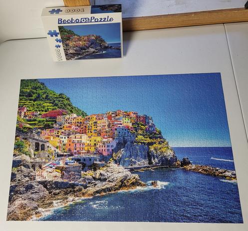 Completed jigsaw puzzle of a picture of the Amalfi Coast in Italy.
