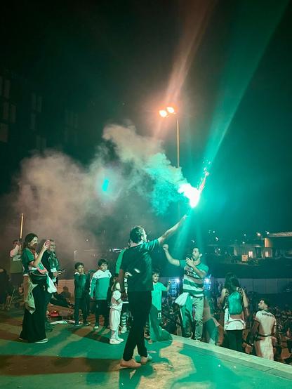 Sporting clube de Portugal celebrations for the league at night, with green lights and smoke