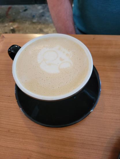 Another coffee with a skull foam art, buy the skull is smaller. It is also upside down because it's for my husband, sitting across from me.
