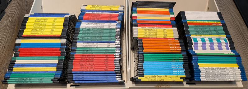Collection of DOS software and games on 3.5in floppies.