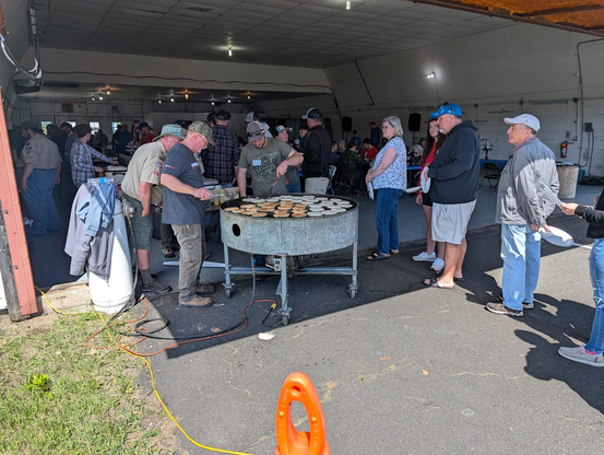 Giant rotating pancake griddle where there is a nonstop supply of pancakes for the non-stop crowd.