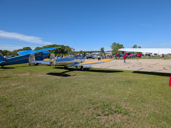 A mostly bare aluminum Ercoupe aircraft with the distinctive H tail.