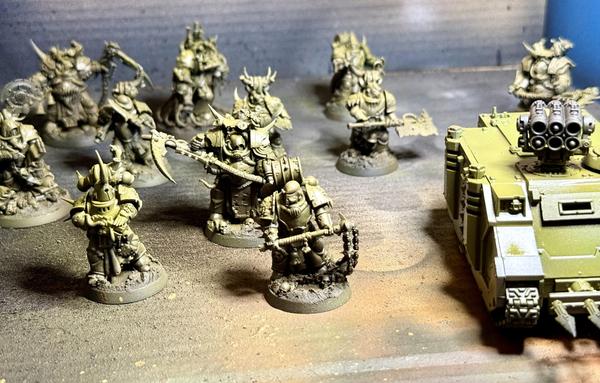 A combat patrol of plague marines, airbrushed in a basic green