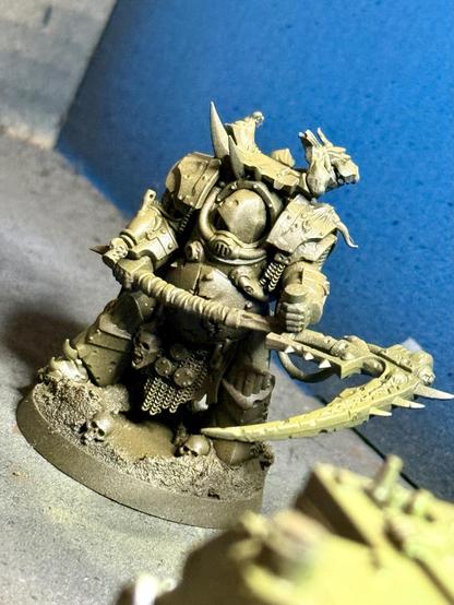 A terminator plague marine with a huge scythe
