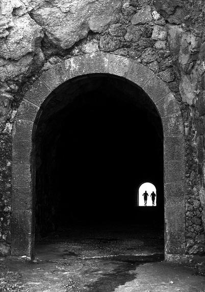 Runners in tunnel. São Martinho do Porto, Portugal.