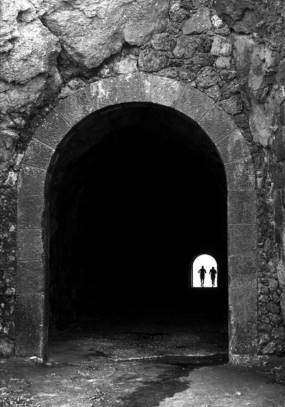 Runners in tunnel. São Martinho do Porto, Portugal.