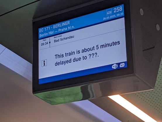 Anzeigetafel im Zug. "This train is about 5 minutes delayed due to ???"