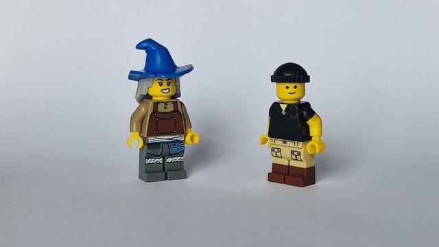 Lego Pete Carrier looking very smart in a black beanie hat, with a pal wearing a blue hat conical crown and a wide brim.