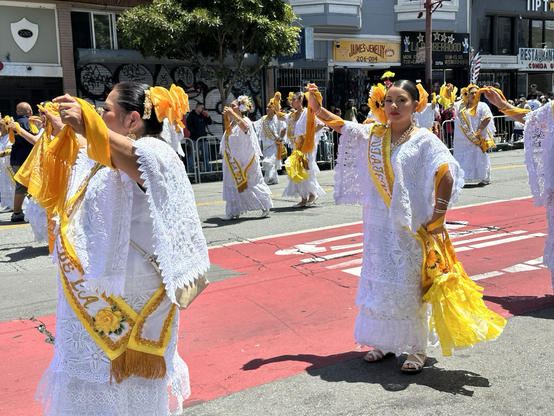 Women in white and yellow outfits