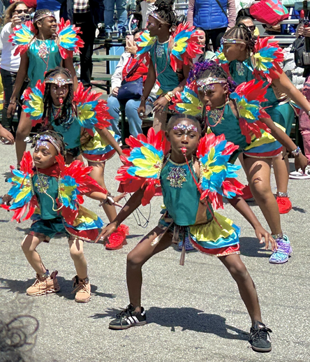 Costumed children dancing