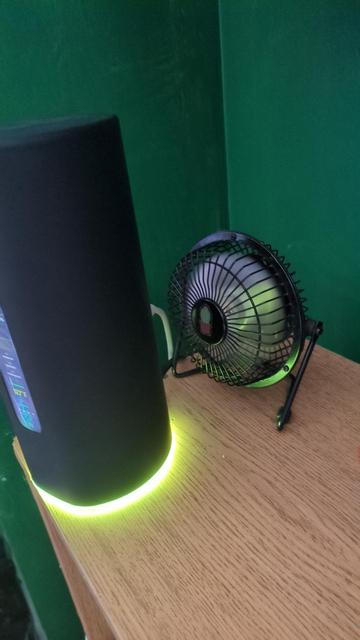 A little metal USB powered fan pointed into the base of the vent holes of an amplifi alien router