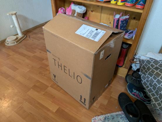 Big cardboard box that says "Thelio" on the side