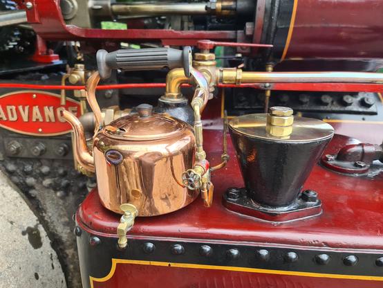 The same engine, with a closeup of a copper kettle that has been plumbed into the engine to provide hot water.
The handle is still attached, but it pretty useless, as the kettle is unmovable! There is a little tap on the side at the bottom to access the hot water.