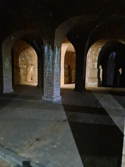 A picture showing the underground water storage structure with amazing vaulted-ceilings, that was used from the 1880 until 1906, when a crack was found in one of the walls, although a reason was never recorded, could have been due to subsidence.
Apparently it holds about 1.5m gallons.

The acoustics were amazing!
Sometimes choirs go to perform down here.