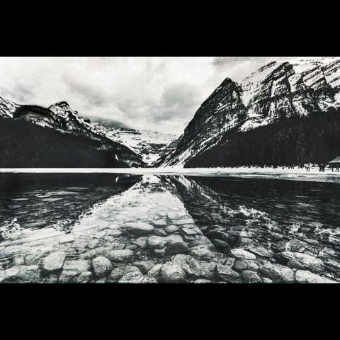 Black and white photo of a lake and the mountain's reflection, Alberta, CANADA