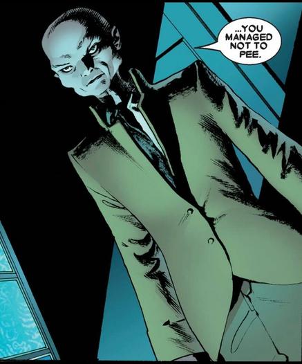 In a darkened room, a bald and excessively skinny evil looking man looks at someone off panel and says, “…you managed not to pee.”