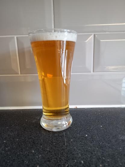 The photo shows a glass of the brew, which I have named 'Not The End Of The World ' because it turned out better than expected.
My verdict:
Decent clarity, amber colour, good head, floral hop aroma, firm bready malt flavour balanced by an excellent hop complexity and followed  by a long bitter finish.