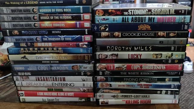 Two stacks of DVDs and one Blu Ray, spines showing. Among these are 5 Tom Baker Doctor who series, a documentary and 26 movies. Many of which I was actually looking for. So score.